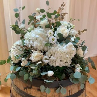 White Arrangements on Wine Barrels