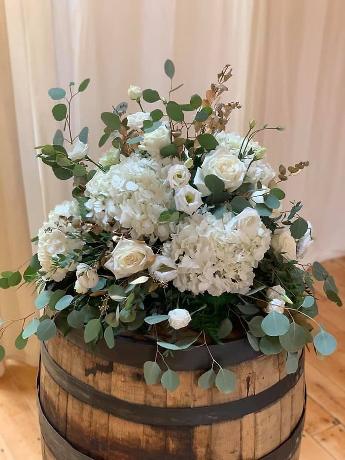 White Arrangements on Wine Barrels